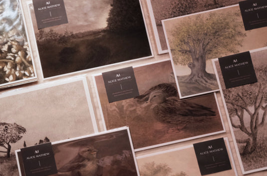 Packaged fine art prints laid out on table